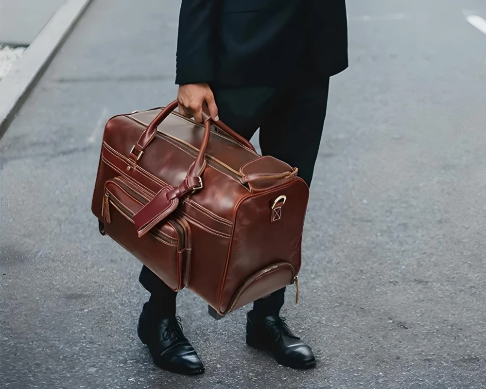 leather carry on bag wheels